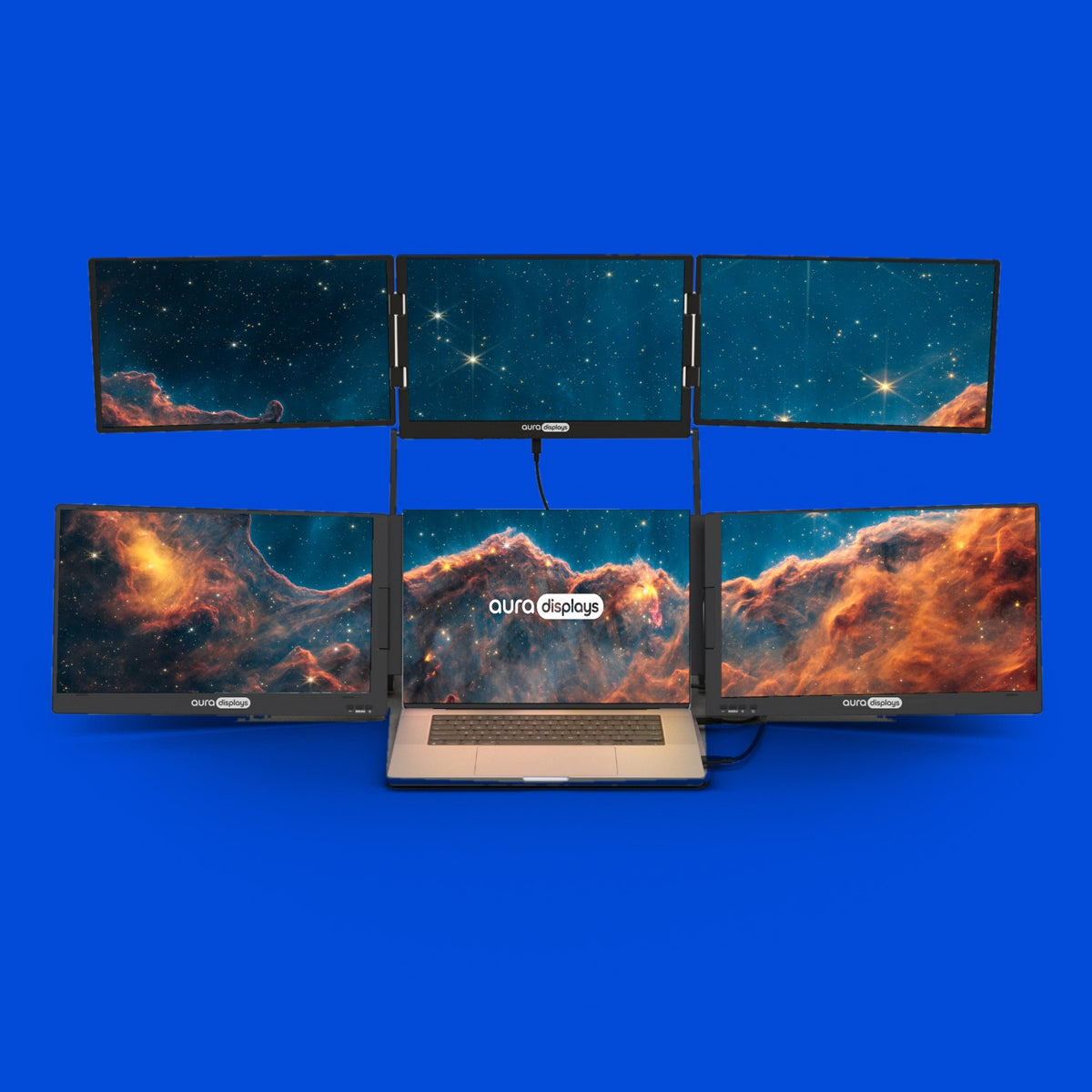 Carina Nebula from James Webb wallpaper shown across six Aura Displays screens with a laptop